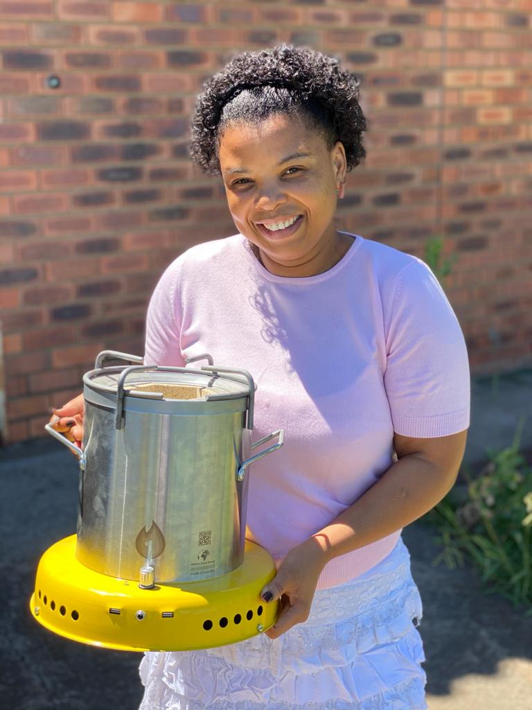 Rethabile Mafura holds an improved coostove