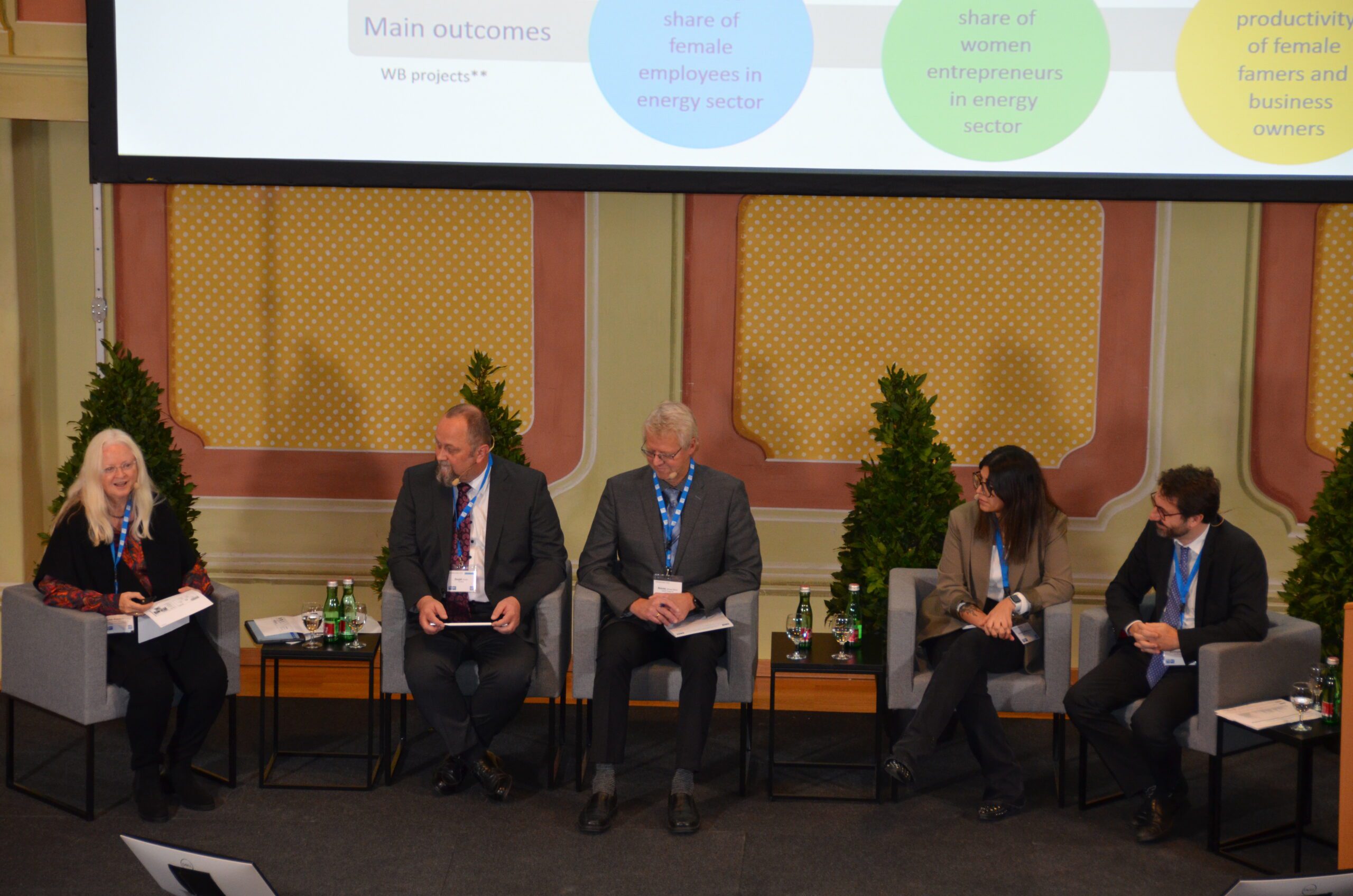 Speakers sitting in a panel